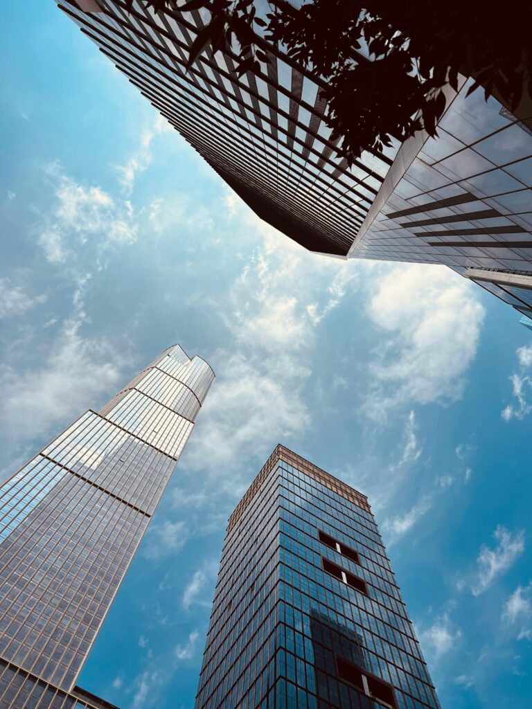 Photo looking up at tall high rise buildings